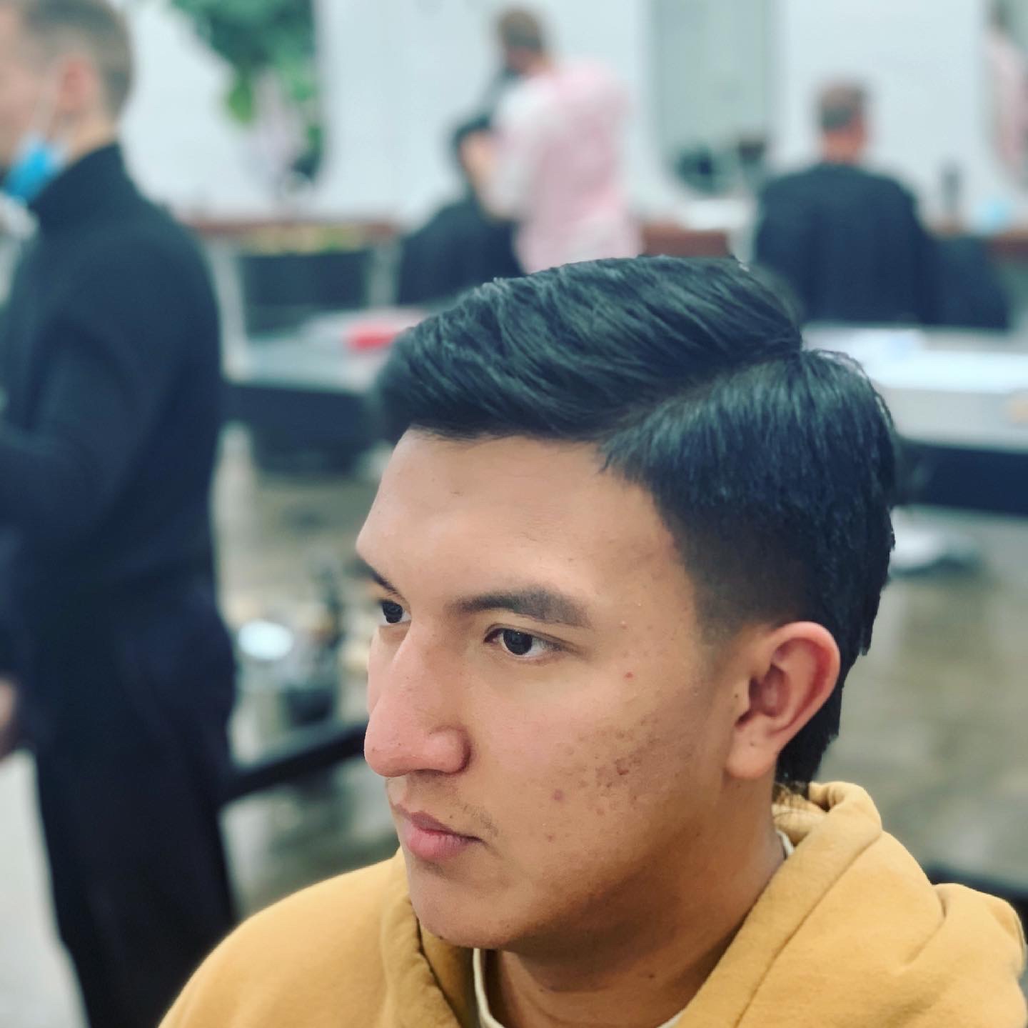 A finished side part with a low taper